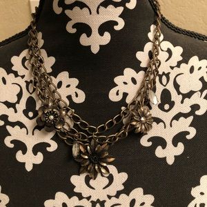 Statement necklace with gems and flowers